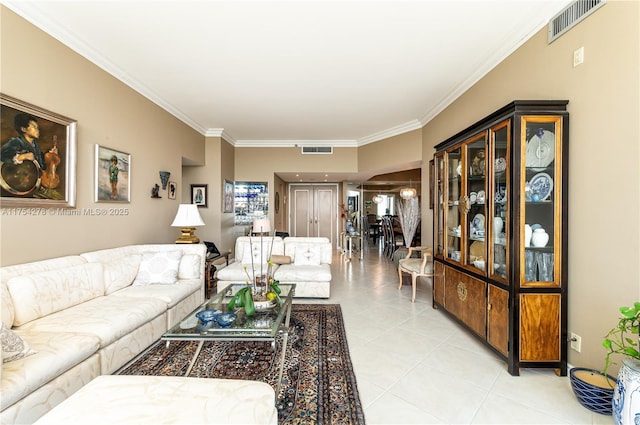 living room with light tile patterned floors, visible vents, and crown molding