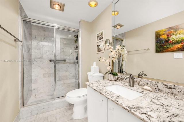 bathroom featuring a marble finish shower, marble finish floor, vanity, and toilet