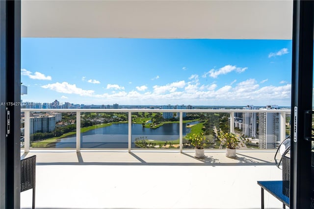 balcony with a view of city and a water view