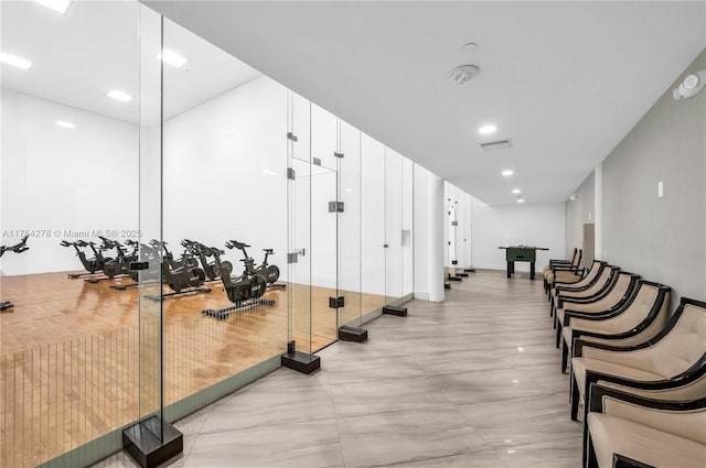 exercise room featuring visible vents