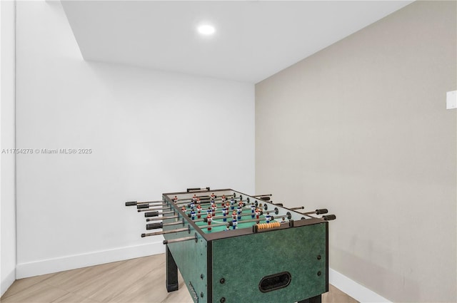 playroom with light wood-type flooring and baseboards