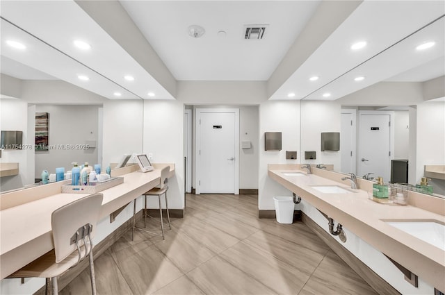 full bath with double vanity, a sink, visible vents, and recessed lighting