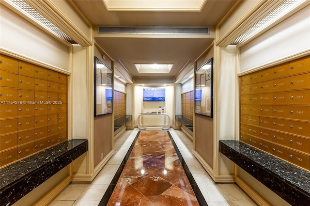 hallway with visible vents and mail area