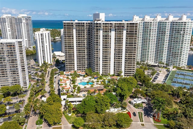 birds eye view of property featuring a water view and a city view