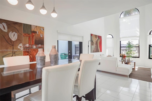 dining space with tile patterned floors