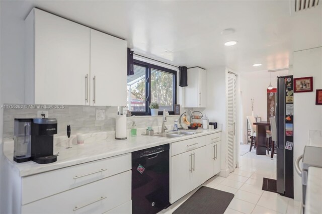 14421 SW 116th Ter, Miami, FL 33186 - kitchen with black appliances, decorative backsplash, light countertops, white cabinets, and recessed lighting
