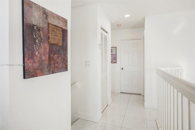14421 SW 116th Ter, Miami, FL 33186 - corridor featuring light tile patterned floors and baseboards