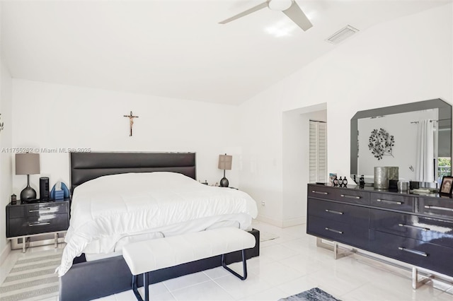 bedroom featuring ceiling fan, light tile patterned floors, visible vents, baseboards, and vaulted ceiling