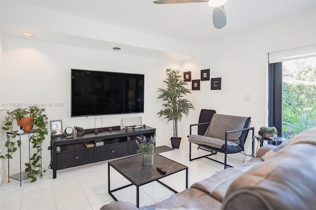 living area featuring light tile patterned floors, ceiling fan, and recessed lighting