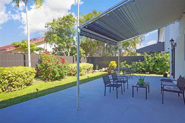 14421 SW 116th Ter, Miami, FL 33186 - fenced backyard featuring a patio