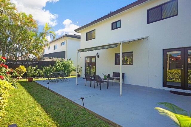 14421 SW 116th Ter, Miami, FL 33186 - back of property featuring french doors, stucco siding, and a patio