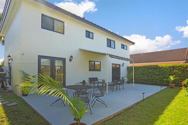 14421 SW 116th Ter, Miami, FL 33186 - rear view of property with french doors, stucco siding, and a patio area