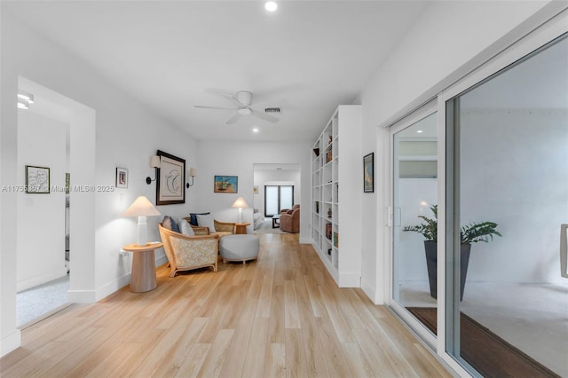 sitting room with recessed lighting, visible vents, ceiling fan, light wood-type flooring, and baseboards