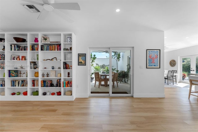 living area with ceiling fan, recessed lighting, wood finished floors, visible vents, and french doors