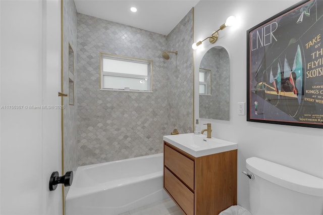 full bathroom featuring shower / bathing tub combination, vanity, and toilet