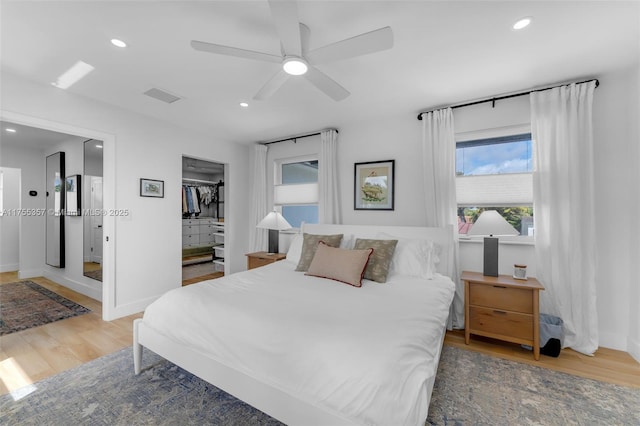 bedroom featuring recessed lighting, a closet, visible vents, and light wood finished floors