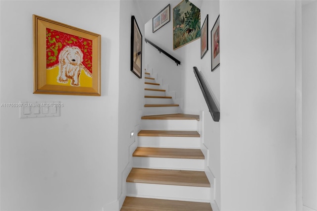 stairs featuring baseboards