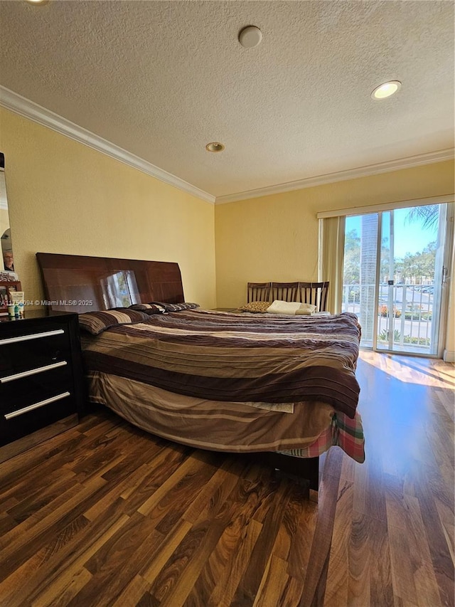 bedroom with access to exterior, a textured ceiling, dark wood-style floors, and crown molding
