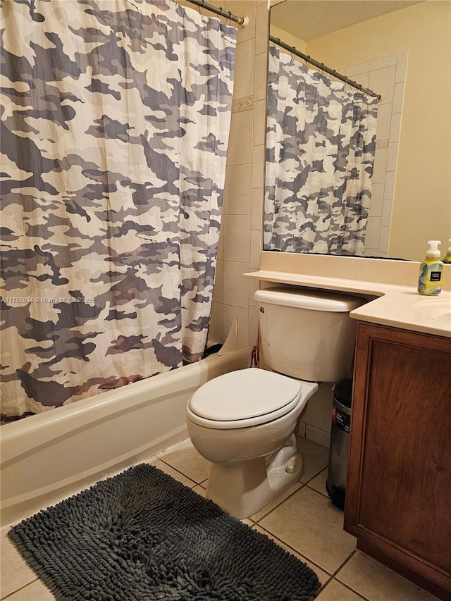 full bathroom featuring toilet, tile patterned flooring, shower / bathtub combination with curtain, and vanity