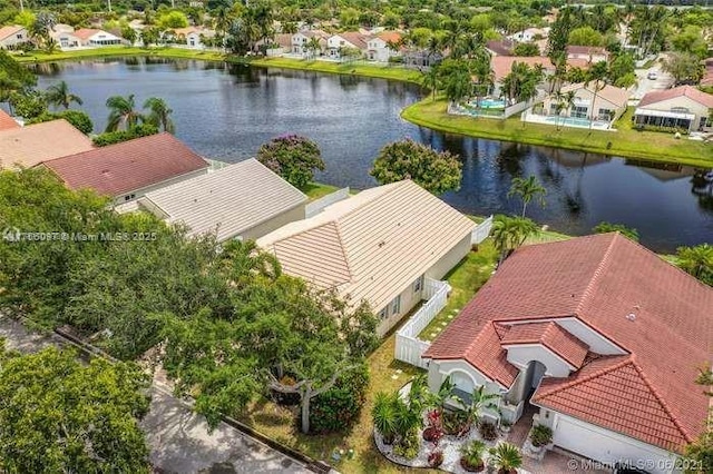 drone / aerial view with a water view and a residential view