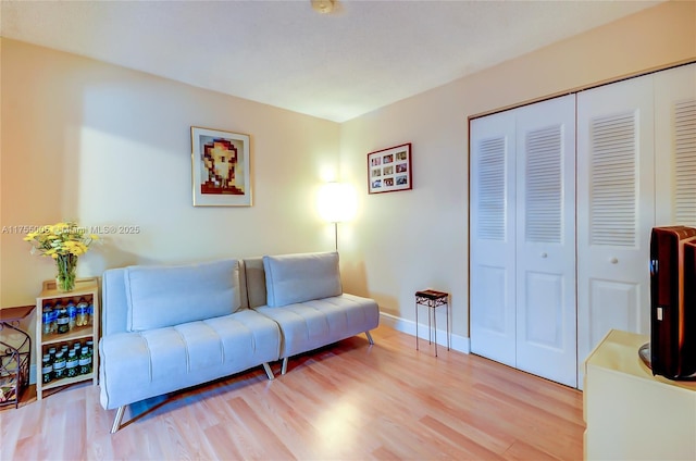 living room featuring light wood-style floors and baseboards