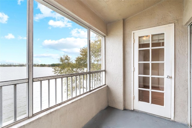 balcony featuring a water view