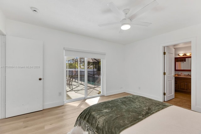 bedroom with access to exterior, light wood-style flooring, ensuite bathroom, ceiling fan, and baseboards