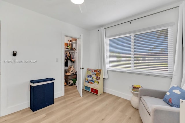 interior space featuring light wood-style floors and baseboards