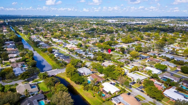 bird's eye view with a water view and a residential view