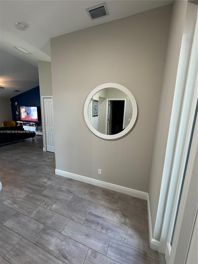 spare room featuring visible vents and baseboards