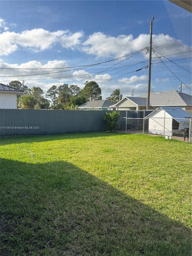 view of yard with a fenced backyard