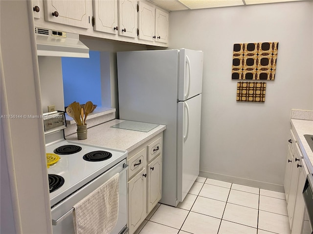 kitchen featuring light tile patterned floors, under cabinet range hood, white appliances, baseboards, and light countertops