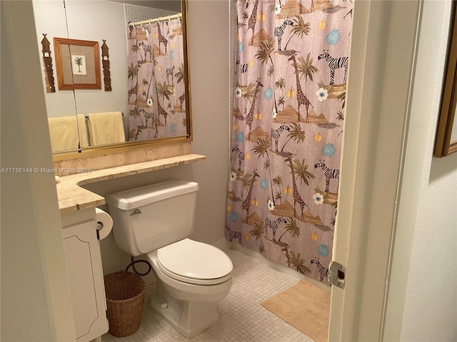 full bathroom featuring a shower with curtain, vanity, toilet, and tile patterned floors