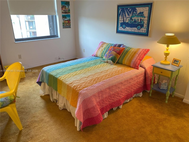 carpeted bedroom with baseboards