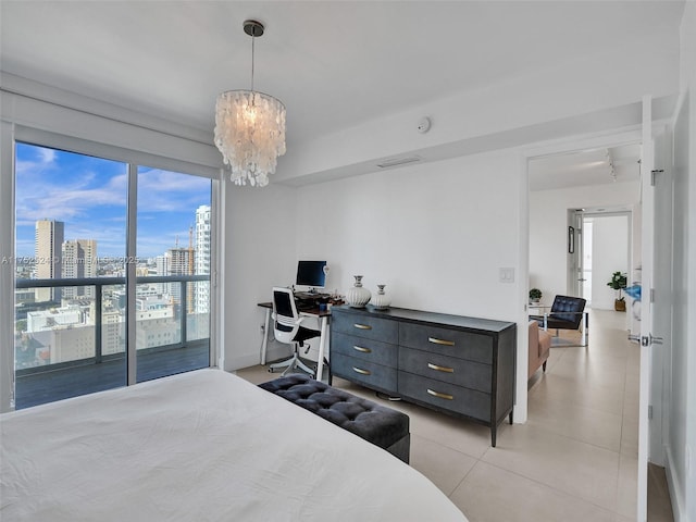 bedroom with an inviting chandelier and light tile patterned floors