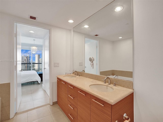 full bathroom featuring tile patterned flooring, visible vents, a sink, and recessed lighting