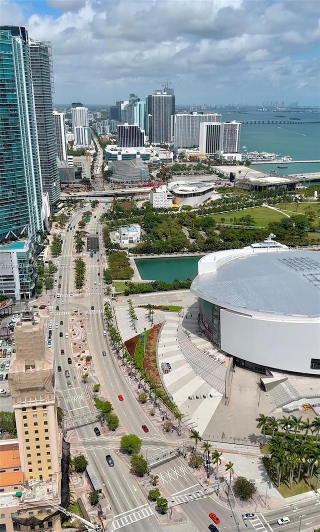 birds eye view of property featuring a view of city and a water view