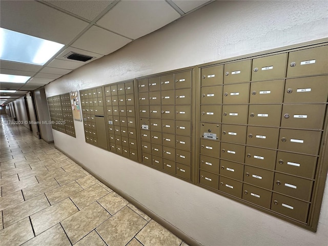 surrounding community featuring visible vents and mail area