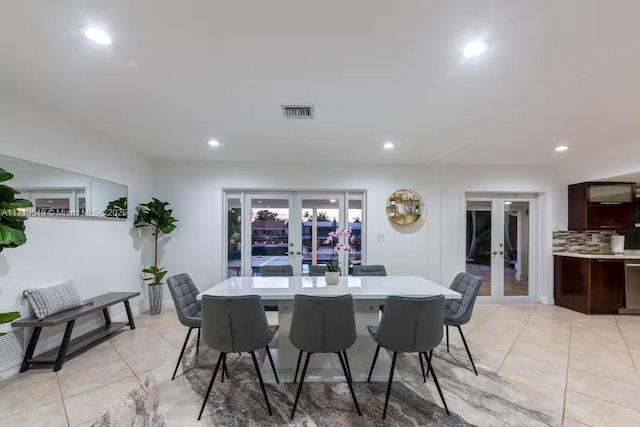 dining area featuring light tile patterned flooring, recessed lighting, visible vents, and french doors