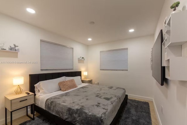 bedroom featuring recessed lighting and baseboards