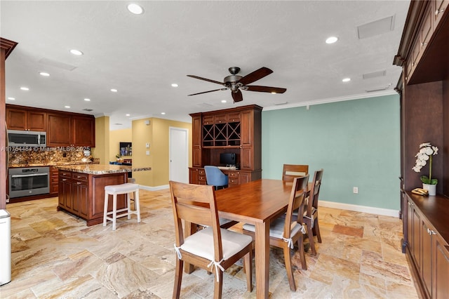 dining space with a ceiling fan, baseboards, crown molding, and recessed lighting