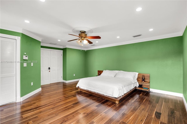 bedroom featuring ornamental molding, recessed lighting, wood finished floors, and baseboards