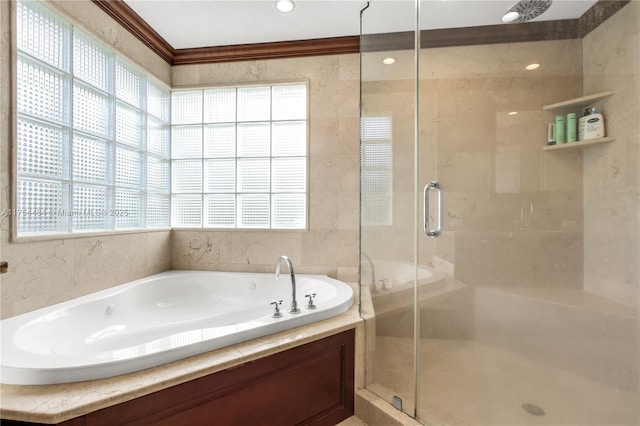 full bathroom featuring a stall shower, a bath, and crown molding