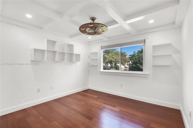 spare room featuring baseboards, coffered ceiling, and dark wood-type flooring