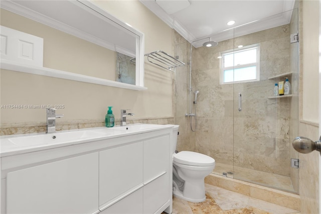 full bath featuring ornamental molding, a sink, toilet, and a shower stall