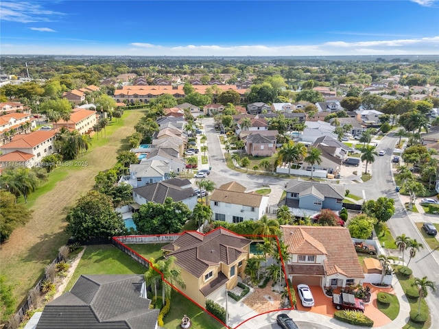 birds eye view of property with a residential view