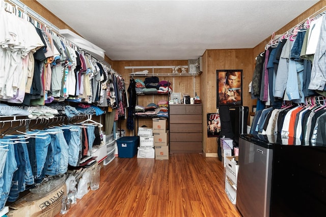 walk in closet featuring wood finished floors