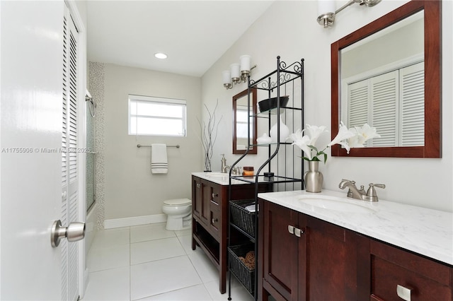 full bath with baseboards, toilet, tile patterned flooring, bathtub / shower combination, and vanity