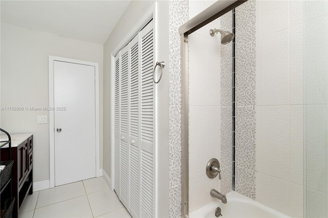 full bathroom featuring shower / washtub combination, a closet, vanity, tile patterned flooring, and baseboards