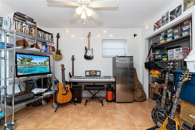 tiled office featuring a ceiling fan